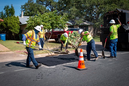 Austin Public Works crew performing street repair