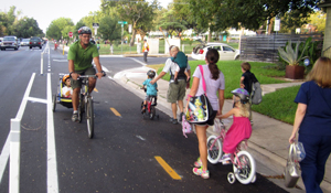 people riding bikes with kids